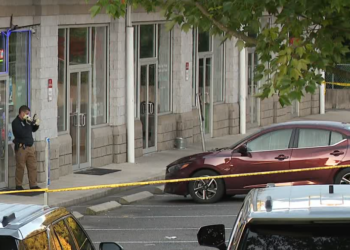 Police investigate homicide after man found with multiple gunshot wounds in Seymour plaza parking lot