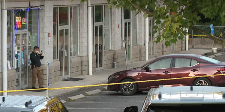 Police investigate homicide after man found with multiple gunshot wounds in Seymour plaza parking lot